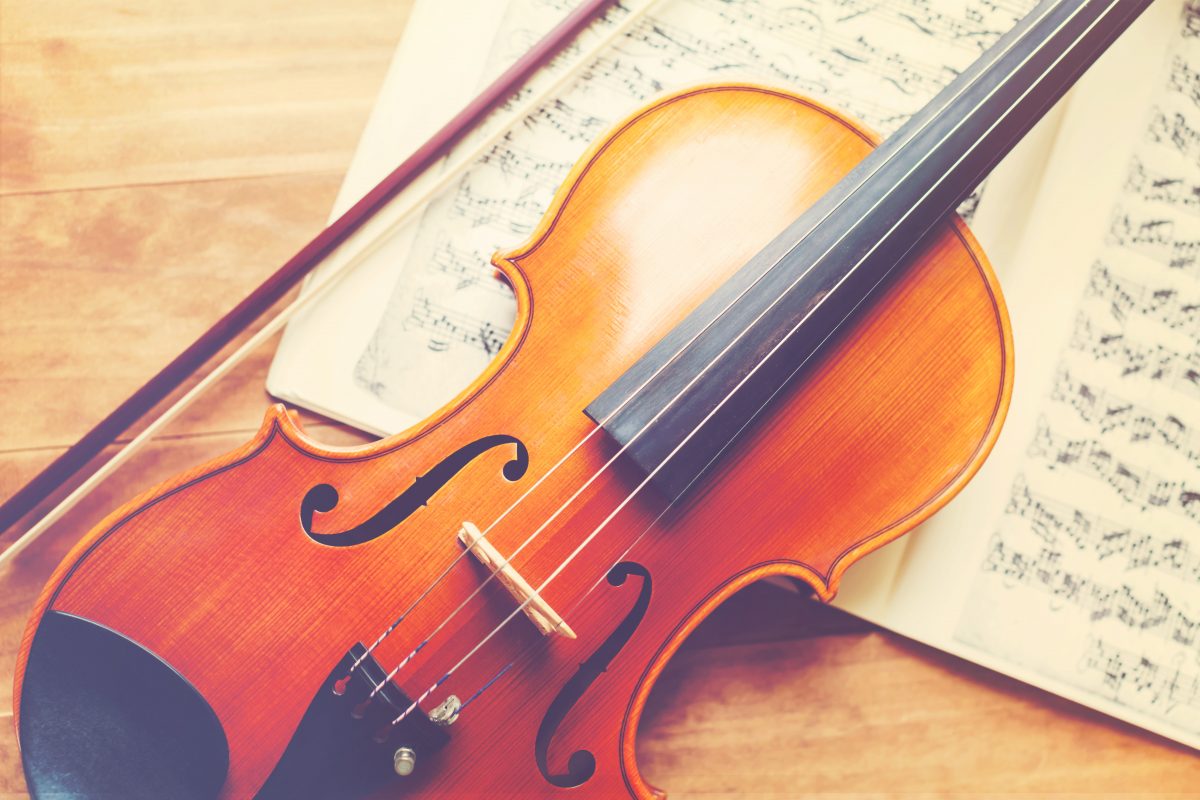 Violin on a wooden textured table